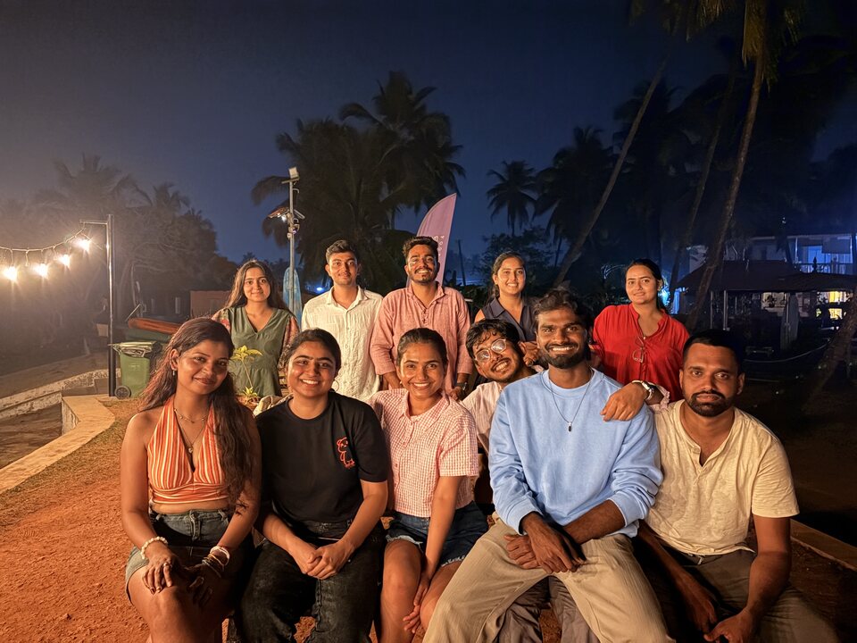 Warm outdoor group gathering at night.