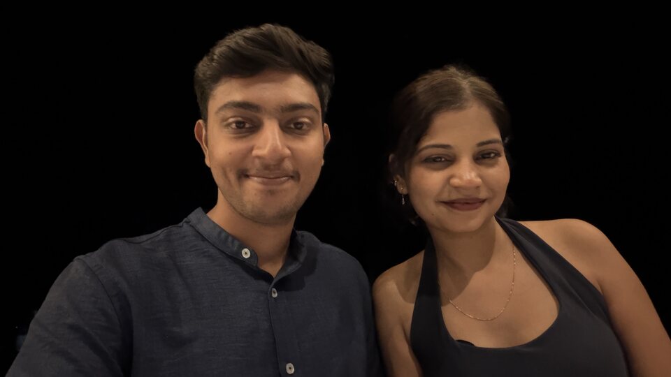 Cleanly framed dressed-up couple portrait.