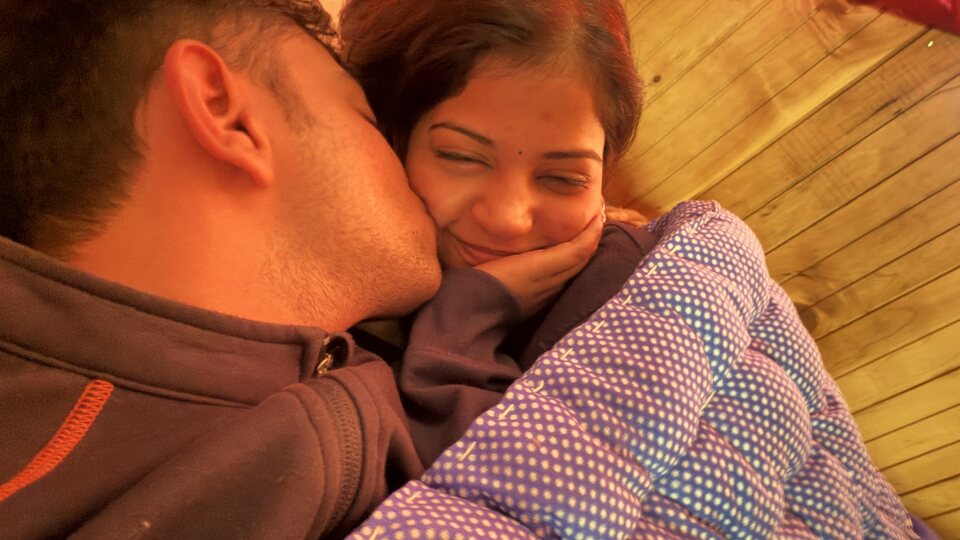 Cozy close portrait under warm light.