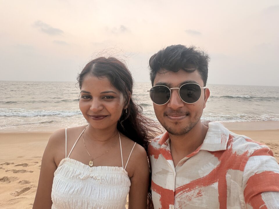 Smiling couple together by the sea.