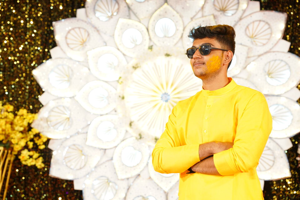 Bright formal-event portrait in yellow attire.